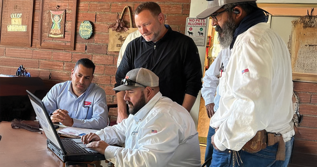 Group of technicians using setting up wifi for businesses